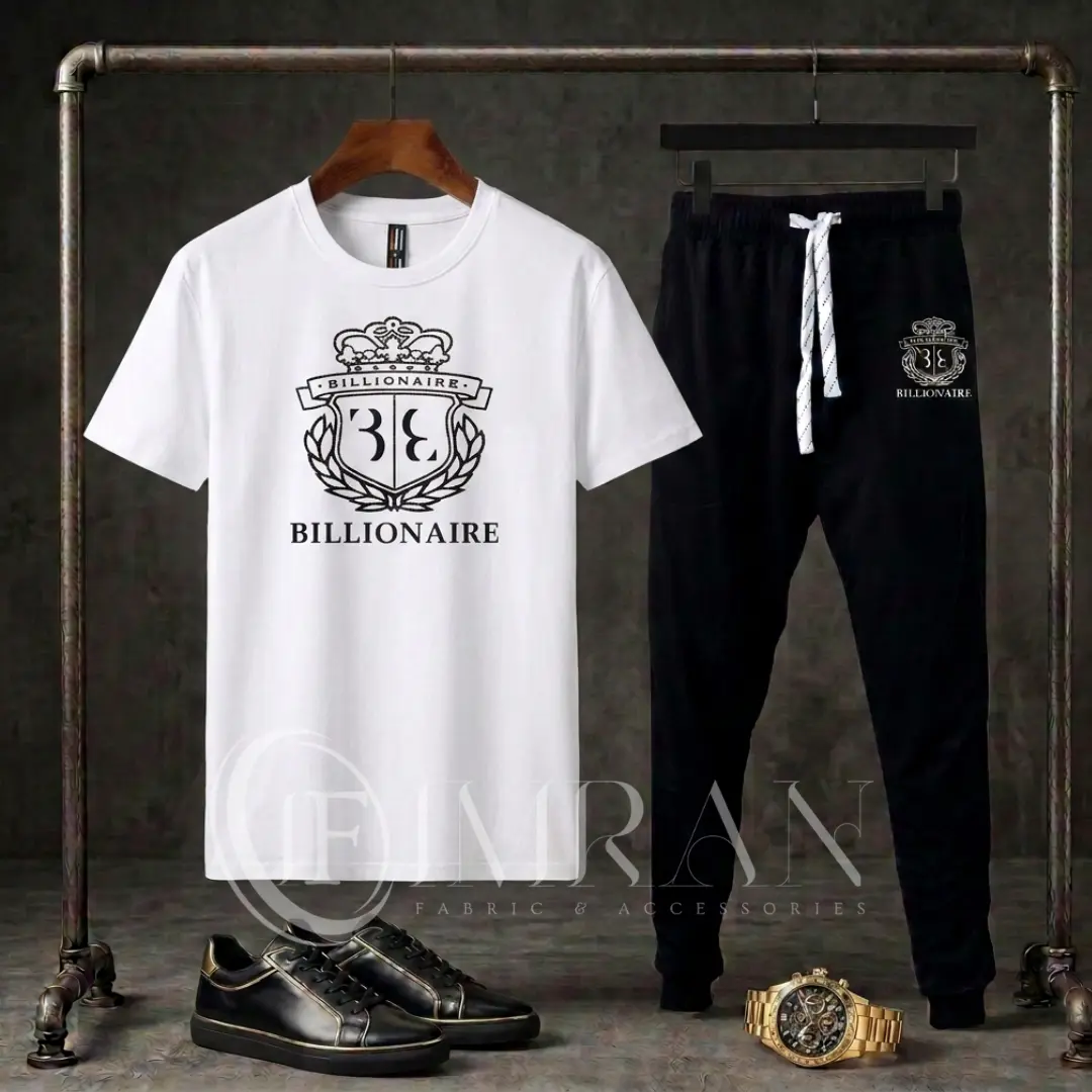 Full 2-piece men's tracksuit featuring a arctic-White "BILLIONAIRE" graphic t-shirt and onyx black joggers hanging on an industrial clothing rack