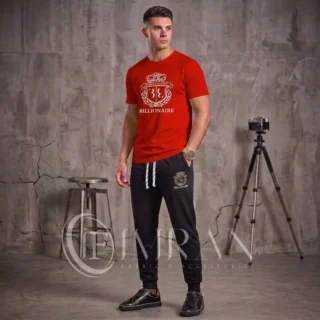 Model showcasing the Crimson Red Billionaire luxury activewear set, featuring a premium cotton graphic tee and onyx black joggers -1